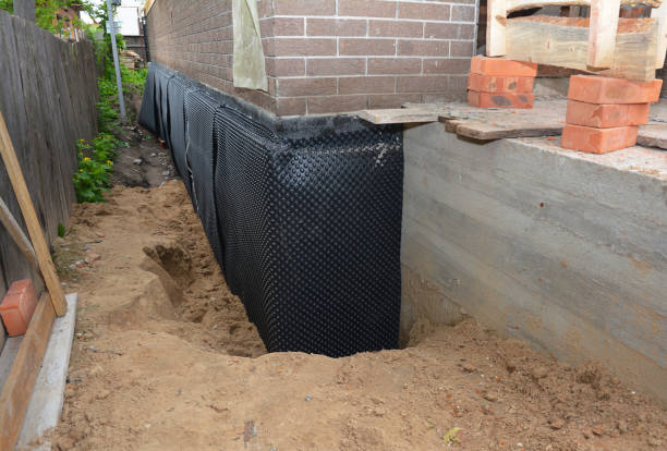 SJ Waterproofing Pros technician performing targeted Wet Basement Repair assessment in Drexel Hill, PA